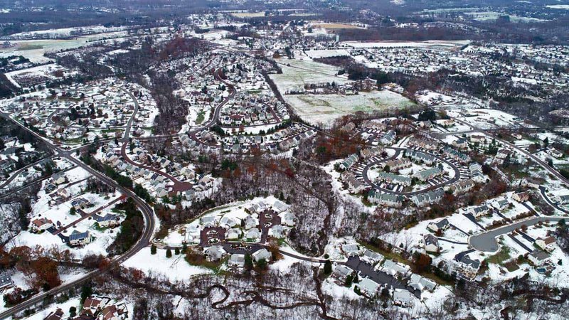 Aerial shot of a town dentist office near Collegeville, PA during cold, snowy winter season